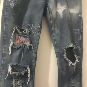 Rockstar studded/distressed & hand painted jeans.